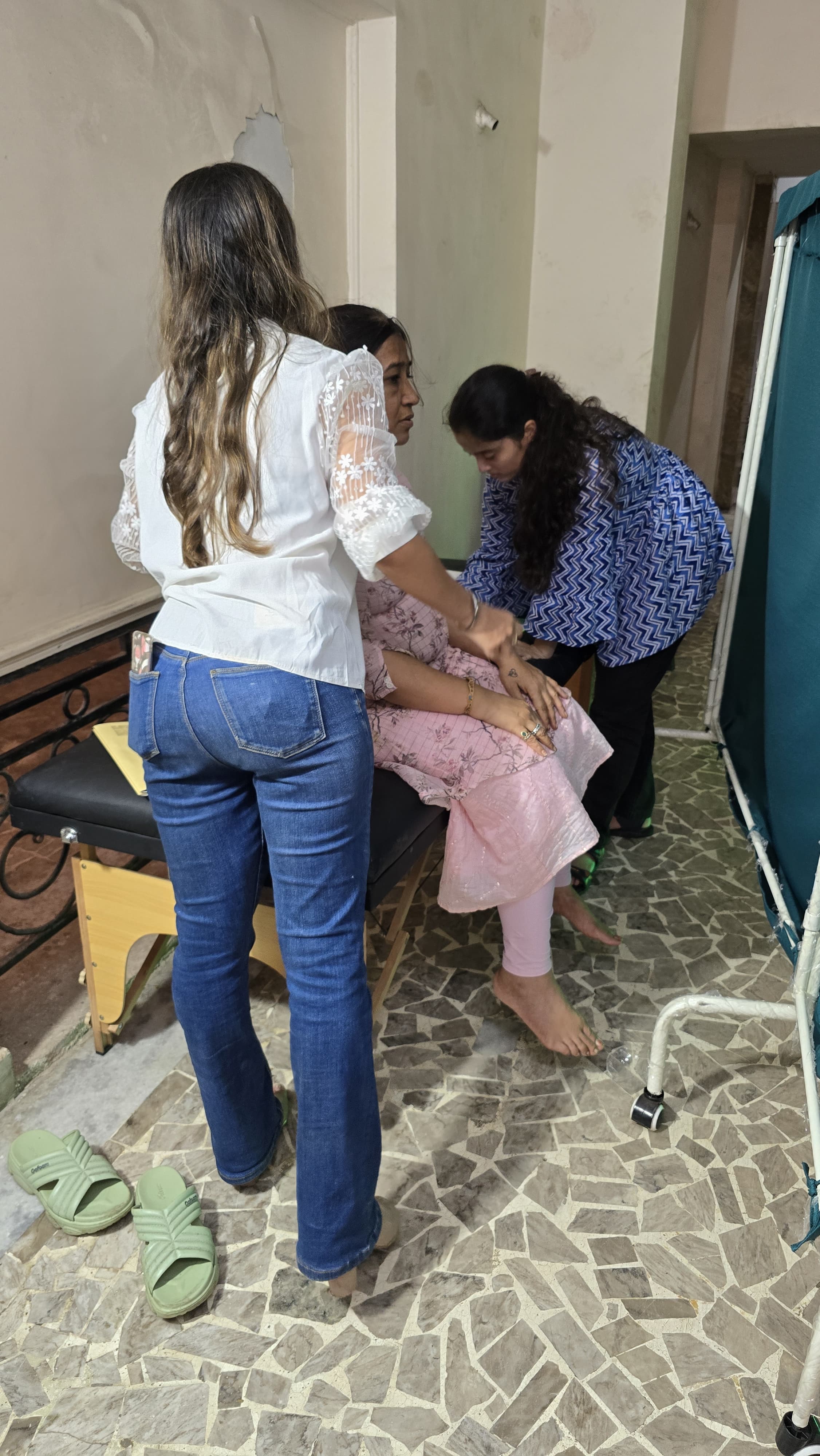 Wellness camp attendees receiving posture screening